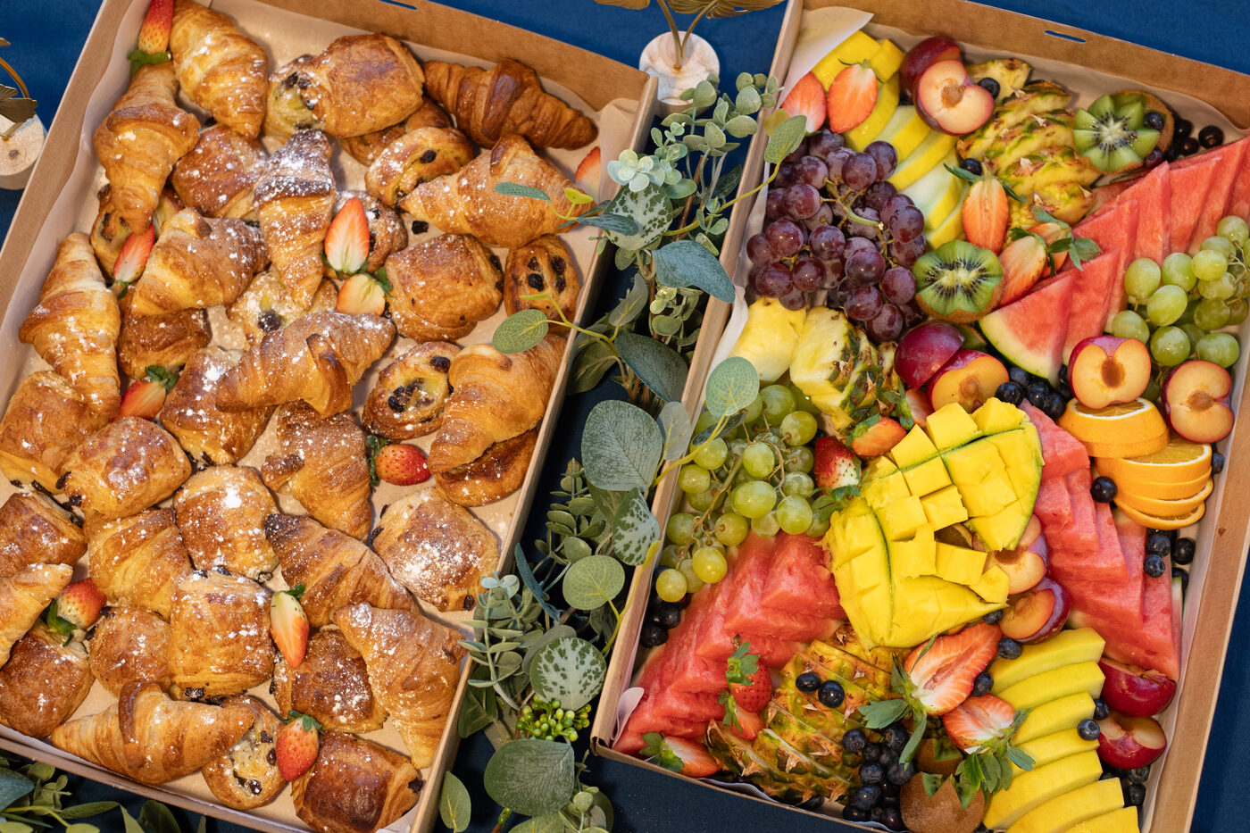 Top-down view of a Graze in the Bay pastry box and seasonal fruit box for a corporate event