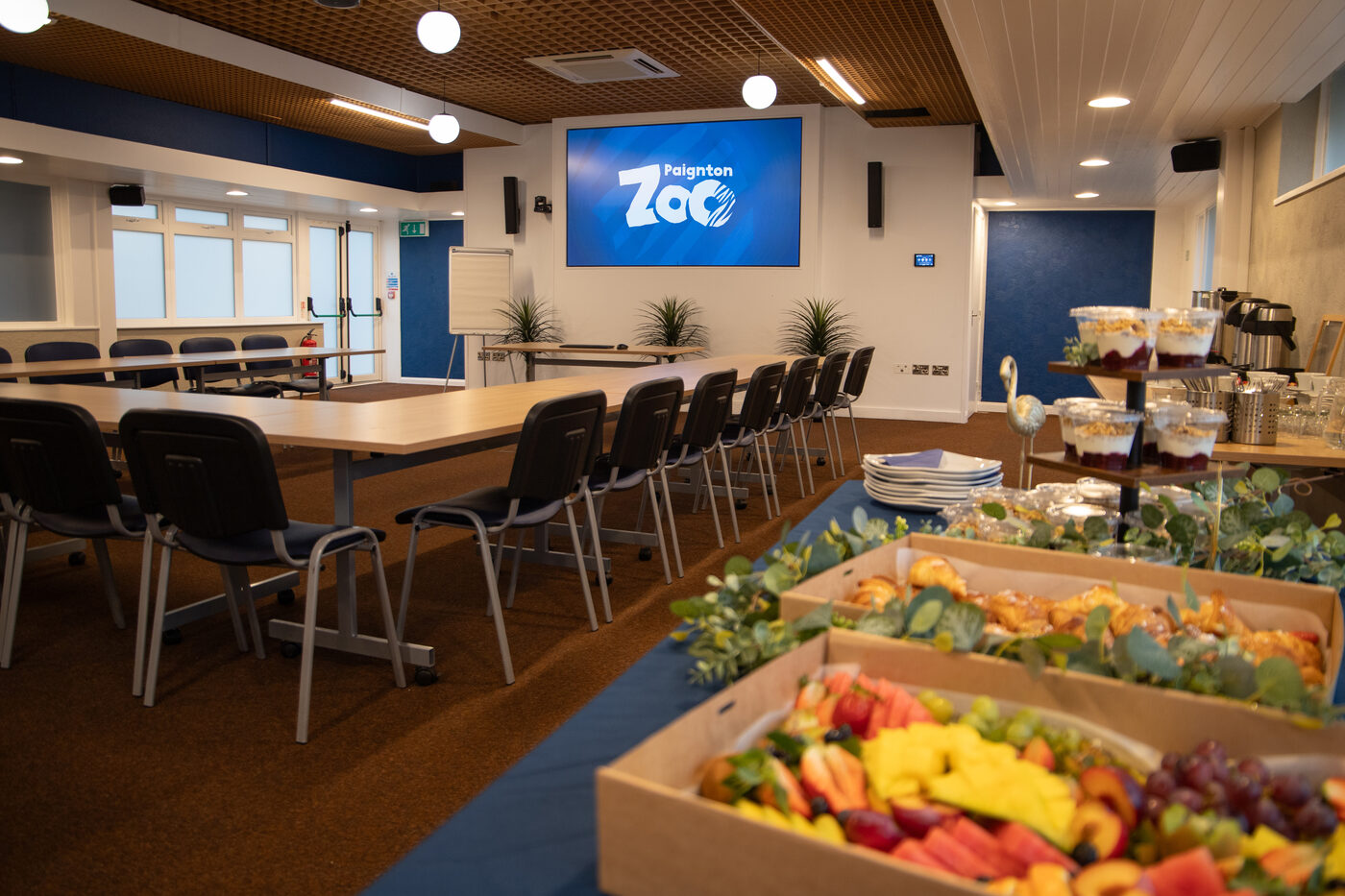 Conference room set up for a Paignton Zoo corporate event with Graze in the Bay catering