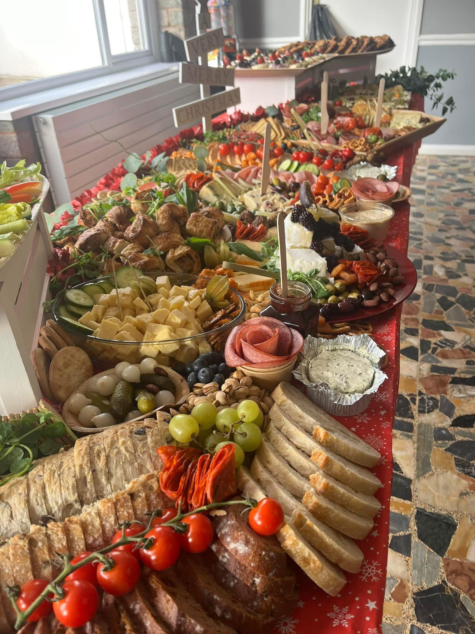 Elegant multi-tiered grazing display with cured meats and cheeses