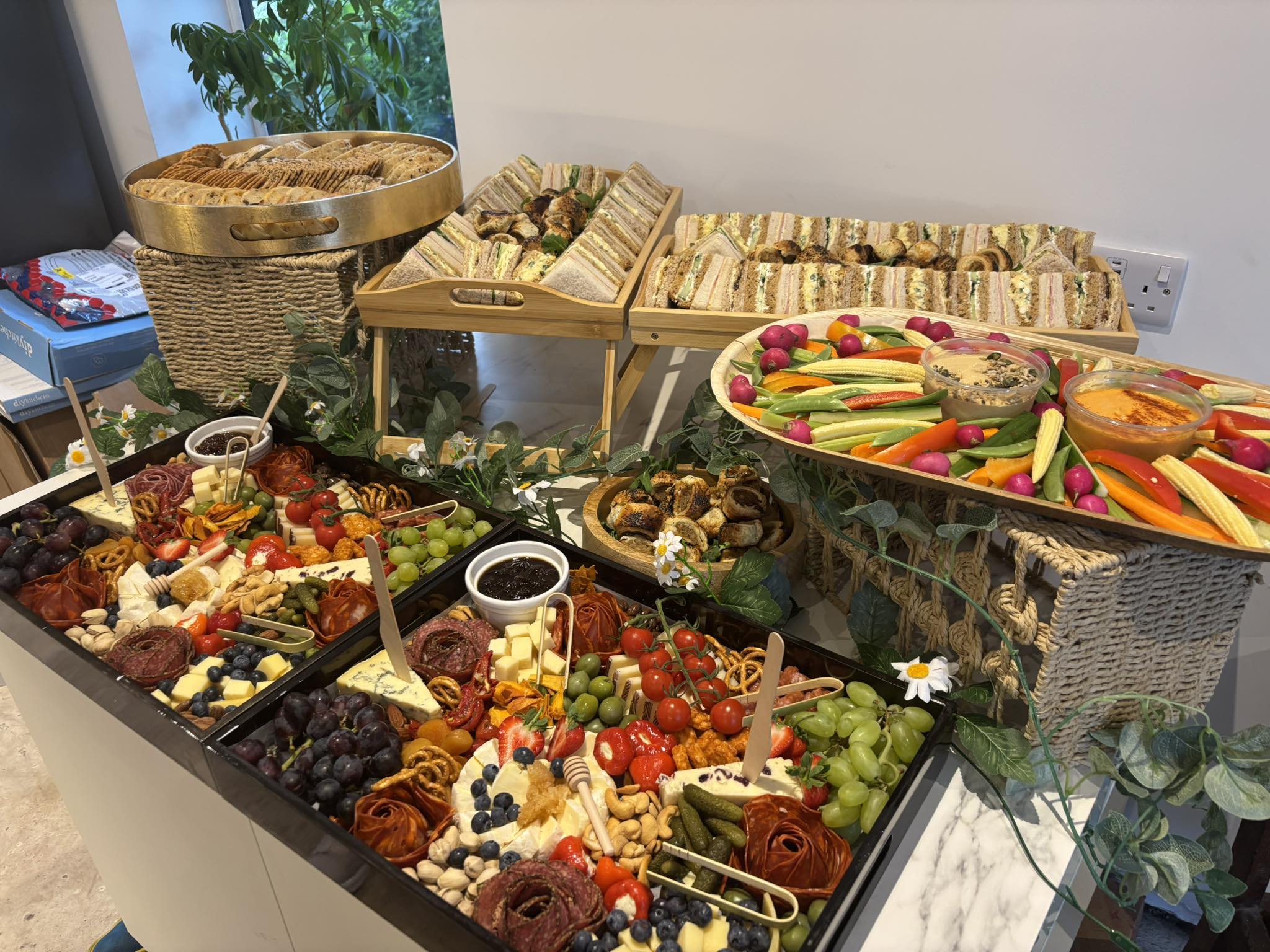 Beautiful grazing table display with charcuterie and edible flowers